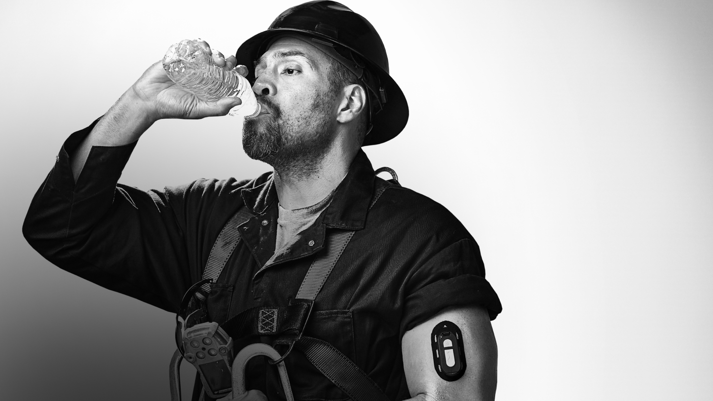 Worker hydrating with safety gear and wearable device