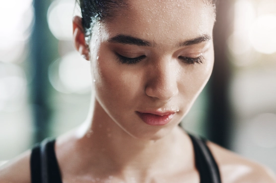 Woman sweating after intense workout session