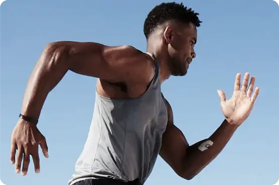 Athlete running with hydration patch on arm